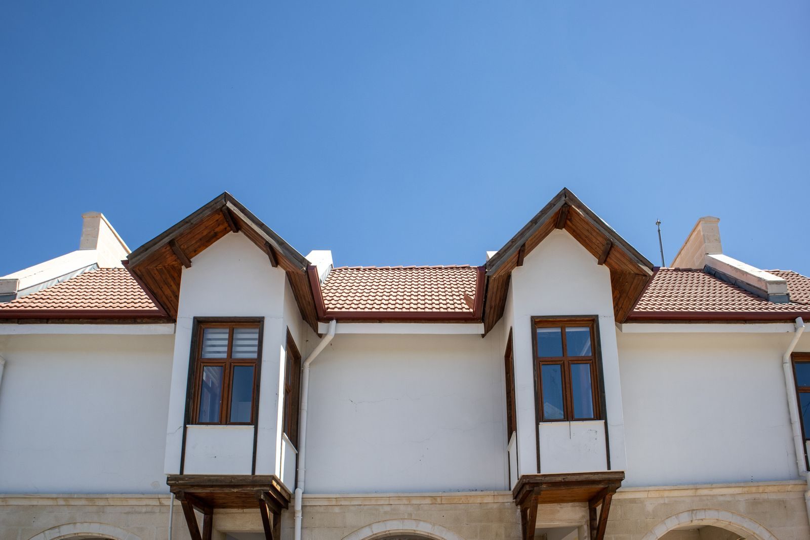 White dormers and roofline guttering on a house